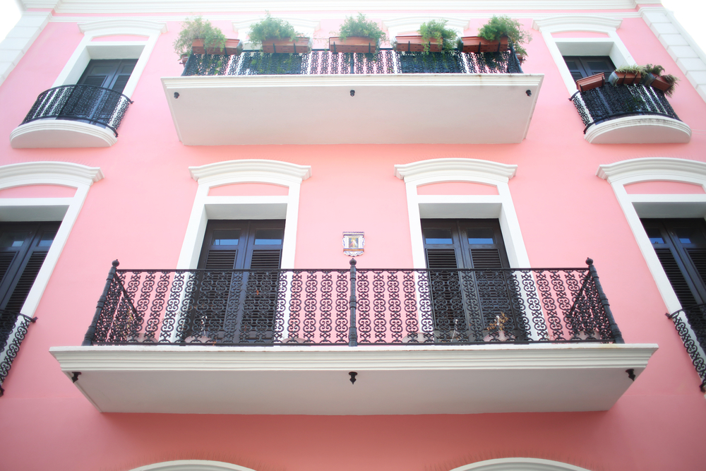 balconies on a pink colorful building in puerto rico